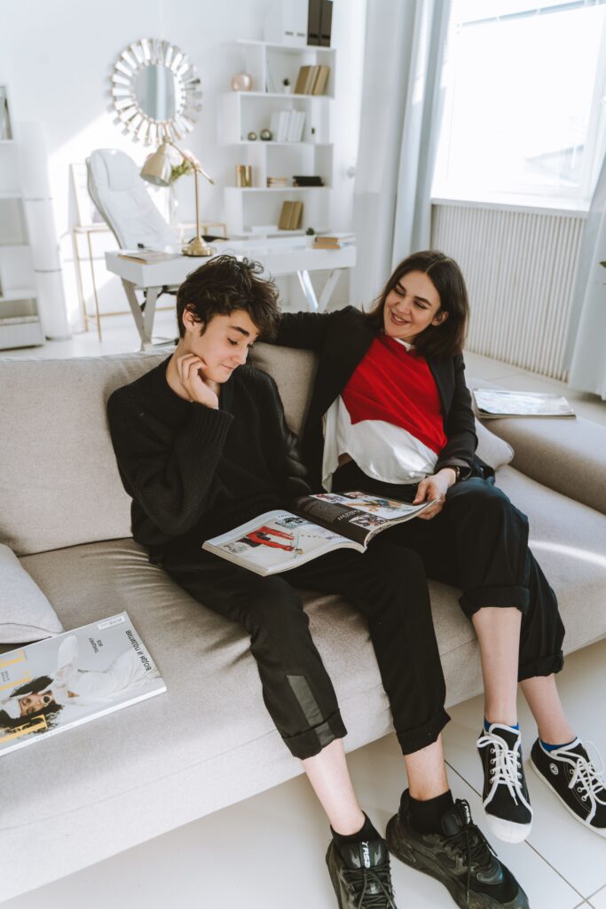 Why Doesn’t My Teenage Son Listen To My Voice Anymore? The Proven reason mother and son looking at a magazine together